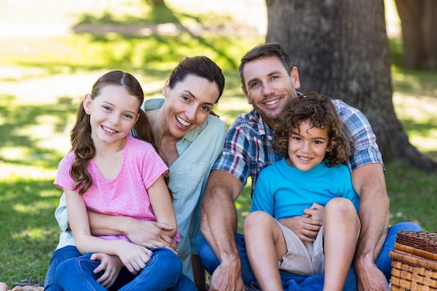 happy family on a picnic in the park