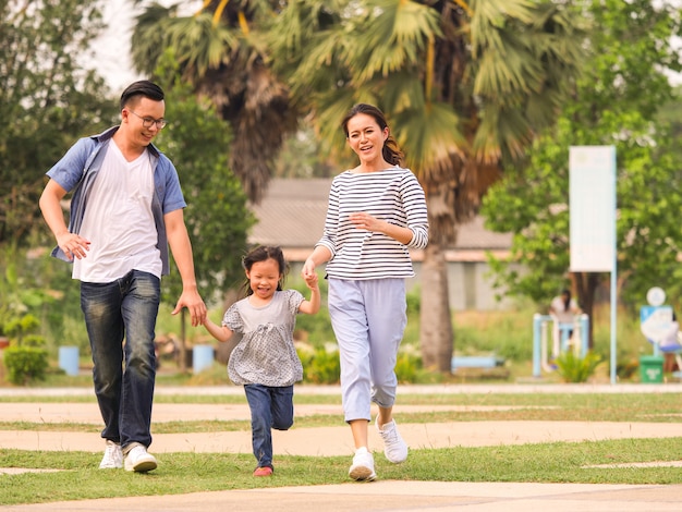 Happy family playing in the park.