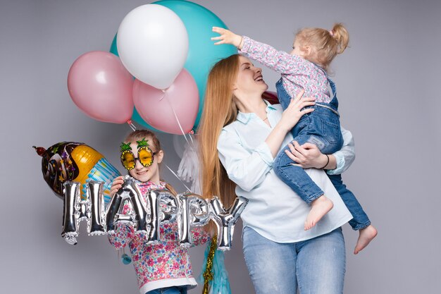 Happy family posing while celebrating birthday party