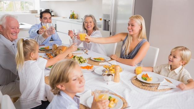 Happy family raising their glasses 