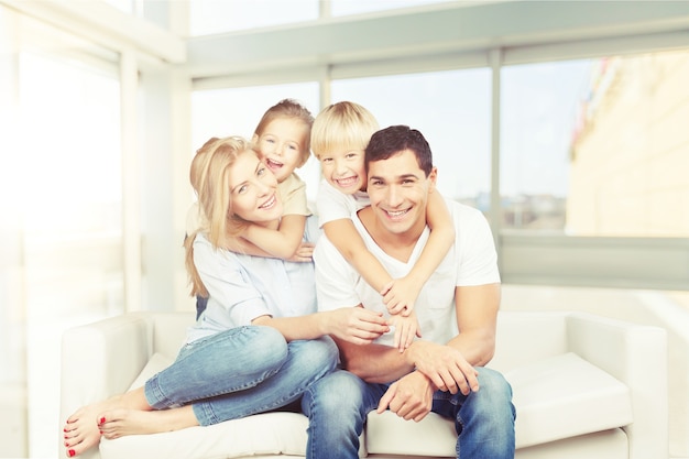 Happy family reading book at home