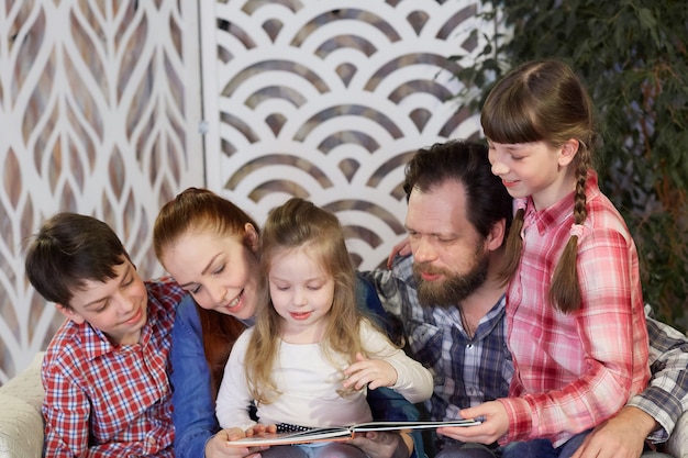 A happy family reads books at home. free time with family