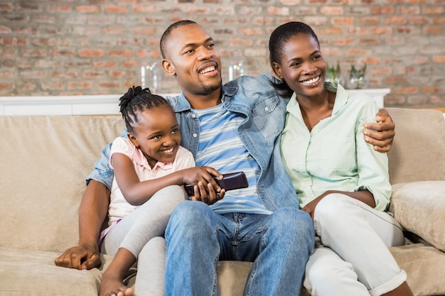 Happy family relaxing on the couch