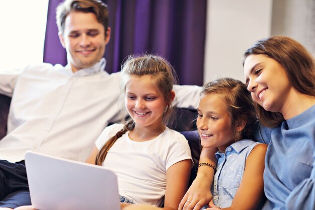 happy family relaxing in hotel room