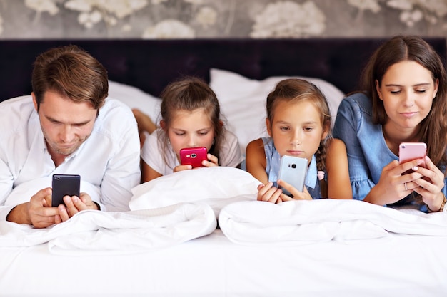 happy family relaxing in hotel room