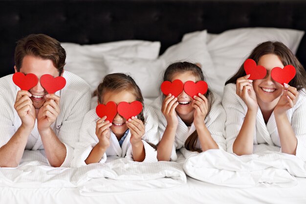 happy family relaxing in hotel room