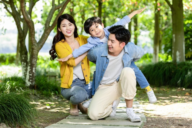 Happy family relaxing in the park at black friday