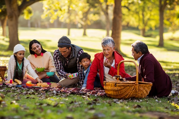 Happy family relaxing at park