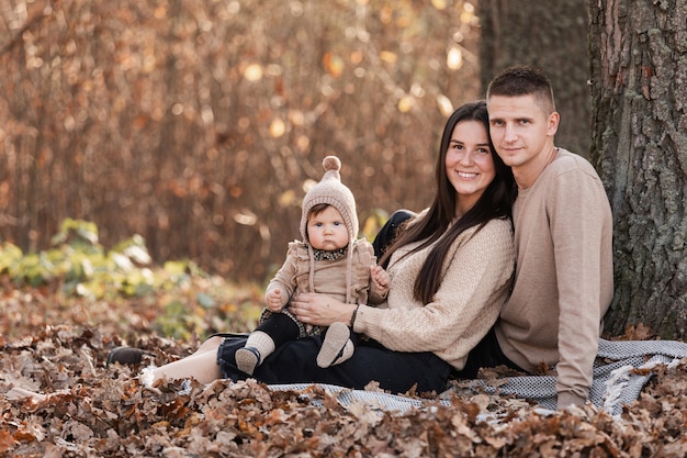 Happy family relaxing in the park