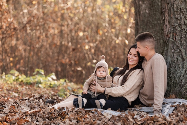 Happy family relaxing in the park