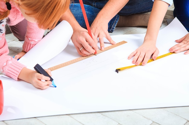 The happy family  at repair and relocation. The family planing  to accommodation on a floor