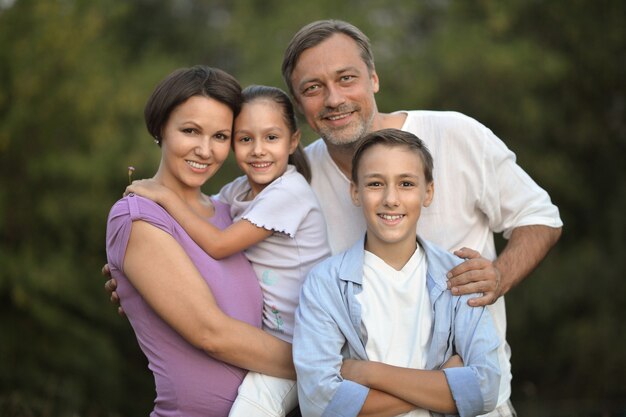 Happy Family resting in a summer park