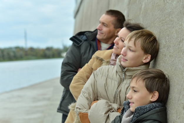 Happy Family at river embankment in autumn