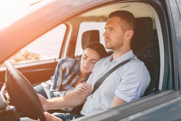 Happy family on a road trip in their car.