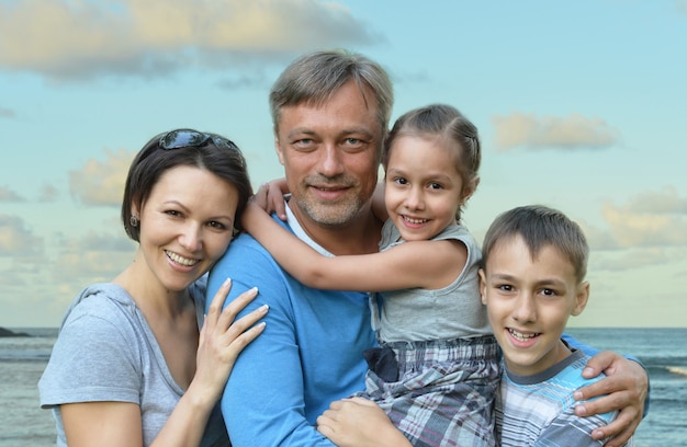 Happy family  on the sea beach background