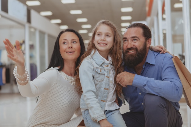 Happy family shopping at the mall together