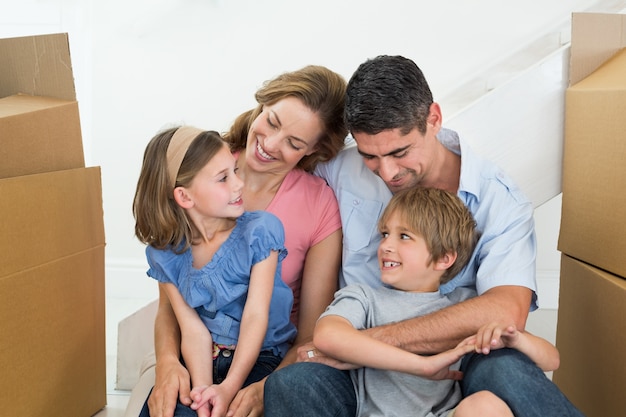 Happy family sitting in new house