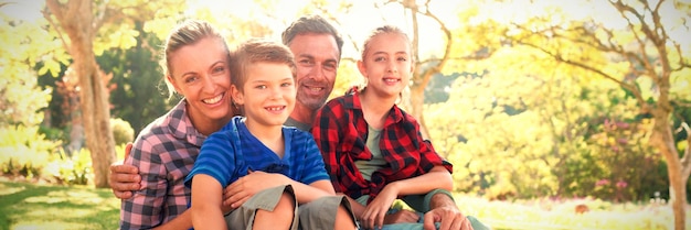 Happy family sitting in the park