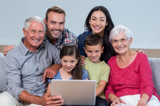 Happy family sitting on sofa