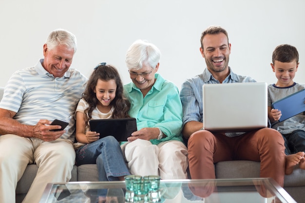 Happy family sitting on sofa