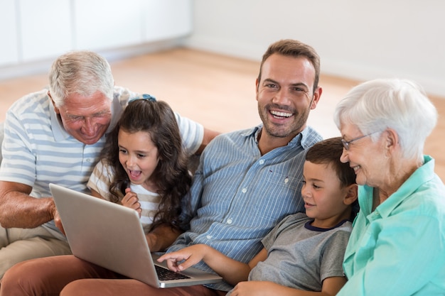 Happy family sitting on sofa