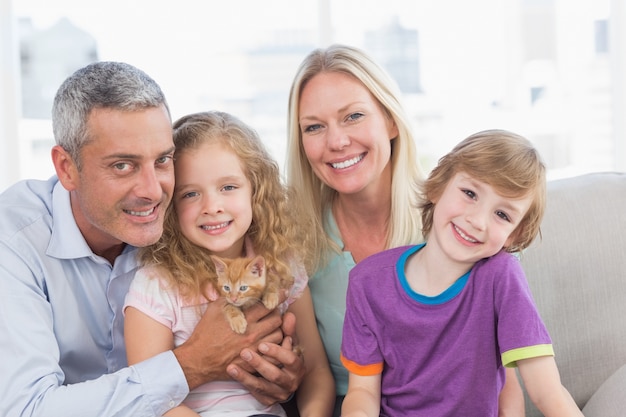 Happy family sitting on sofa