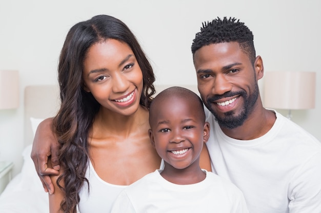 Happy family smiling at camera