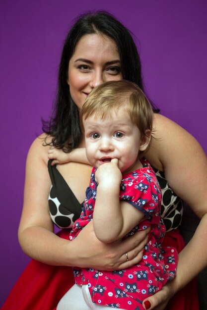 Happy family - smiling mother and little daughter