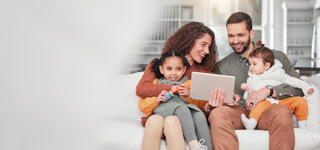 Happy family on sofa with tablet kids and bonding streaming service for child development video with mockup space Mother father and children on couch happiness and smile in digital entertainment