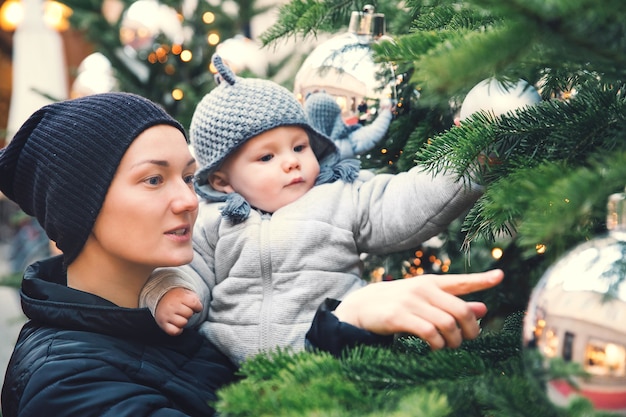 Happy family spend time at a Christmas and New Year holidays in the old town of Salzburg Austria