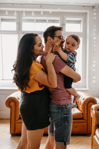 Happy family standing at home