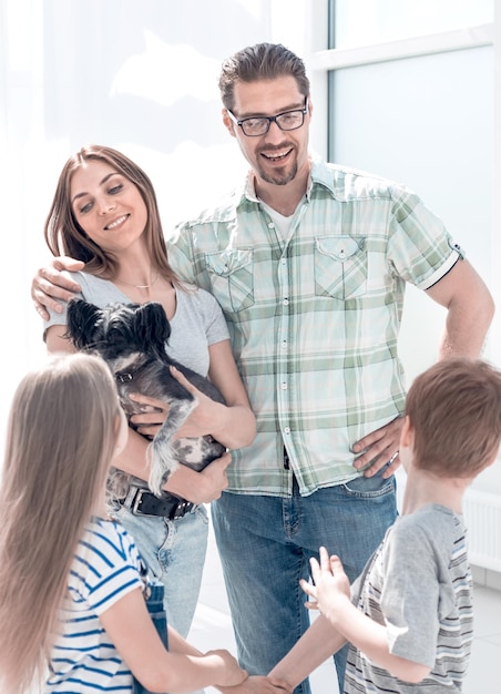 Happy family standing in new apartment