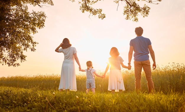 Happy family on summer walk