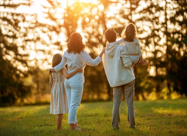 Happy family at sunset