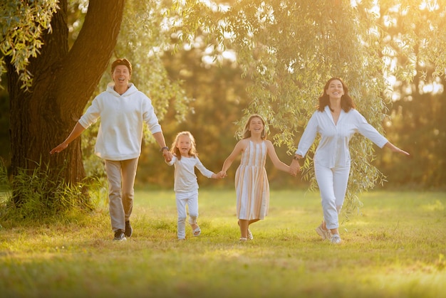 Happy family at sunset