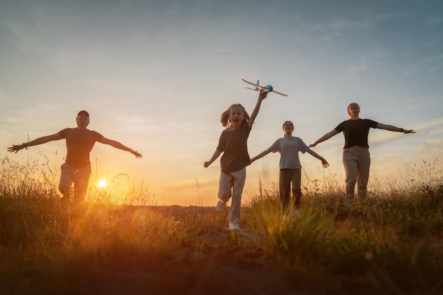 Happy family at sunset