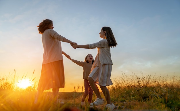 Happy family at sunset