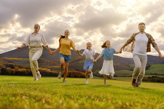 Happy family at sunset