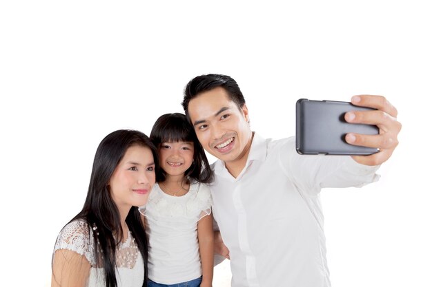 Happy family taking photo on studio