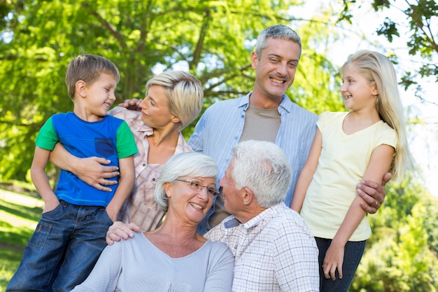 Happy family talking in the park 