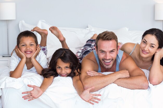 Happy family in their bedroom