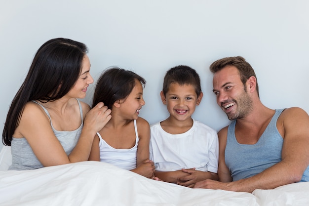 Happy family in their bedroom