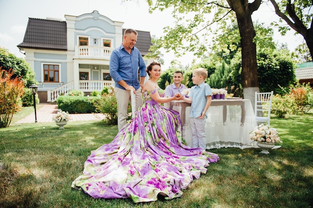 Happy family together in picnic, colorful outdoors