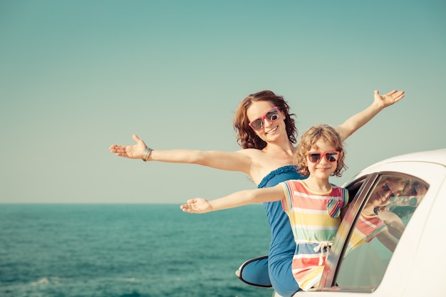 Happy family travel by car People having fun on the beach Summer vacation concept