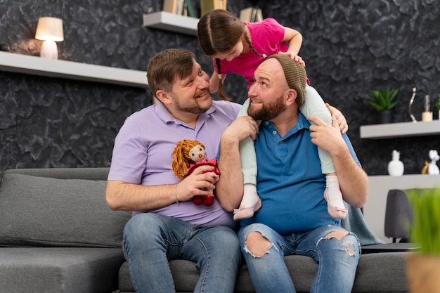 Photo happy family of two dads and a baby