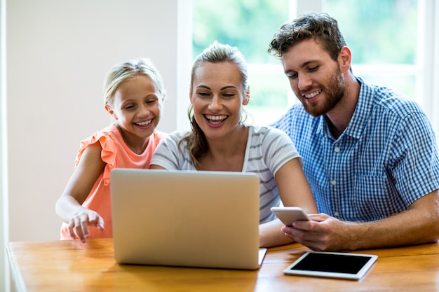 Happy family using laptop