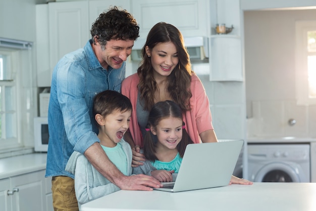 Happy family using laptop