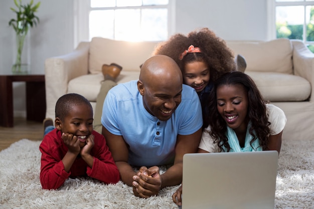 Happy family using laptop