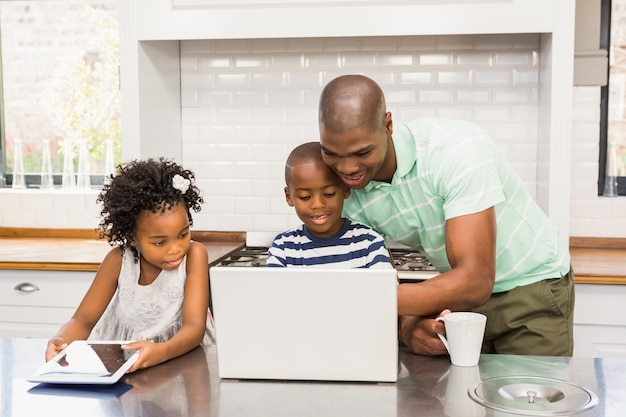 Happy family using laptop