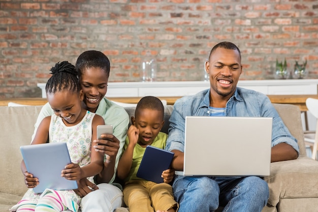 Happy family using technology together